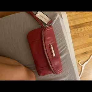 BRAND NEW NINE WEST RED WRISTLET WITH A STAIN